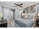 Bright bedroom with ceiling fan, unique wall art, and ensuite bathroom access at 4134 Burgess Dr, Decatur, GA 30035