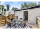 Cozy wooden deck features an outdoor dining set, perfect for relaxing and entertaining at 4134 Burgess Dr, Decatur, GA 30035
