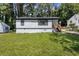Well-manicured lawn and fresh paint give this home great curb appeal at 4134 Burgess Dr, Decatur, GA 30035