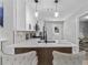 Modern kitchen with white cabinets, quartz countertops, and stainless steel appliances at 4134 Burgess Dr, Decatur, GA 30035