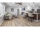 Bright open-concept living area featuring hardwood floors, modern furnishings, and a ceiling fan at 4134 Burgess Dr, Decatur, GA 30035