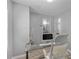 Bright office with window, glass desk, and view to the bathroom at 4134 Burgess Dr, Decatur, GA 30035