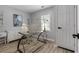 Office with a glass desk, neutral walls, and a door at 4134 Burgess Dr, Decatur, GA 30035