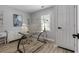 Bright office space with a modern glass desk, white accents, and natural light at 4134 Burgess Dr, Decatur, GA 30035