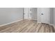 Neutral room with light wood-look floors and modern trim at 4134 Burgess Dr, Decatur, GA 30035