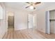 Bedroom with wood-look floors next to an en-suite bathroom and a closet at 2954 Ann Marie Ln, Rex, GA 30273