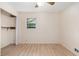 Bedroom featuring wood-look floors, a ceiling fan, a closet and a window with natural light at 2954 Ann Marie Ln, Rex, GA 30273