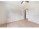 Open bedroom featuring wood floors, a ceiling fan, and a door leading to another room at 2954 Ann Marie Ln, Rex, GA 30273