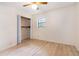 Bedroom featuring wood-look floors, a closet, a ceiling fan, and a window with natural light at 2954 Ann Marie Ln, Rex, GA 30273