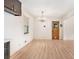 Bright dining room featuring wood floors, a modern chandelier, and lots of natural light at 2954 Ann Marie Ln, Rex, GA 30273