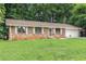 Inviting single-story brick home with a lush green lawn at 2954 Ann Marie Ln, Rex, GA 30273