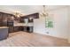 The kitchen features wood floors, ceiling fan, dark cabinets, and white countertop at 2954 Ann Marie Ln, Rex, GA 30273