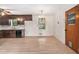 A kitchen featuring dark cabinets, a ceiling fan, and wood flooring at 2954 Ann Marie Ln, Rex, GA 30273