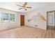 Open living room with new flooring, ceiling fan, wall art, and natural light at 2954 Ann Marie Ln, Rex, GA 30273