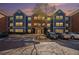 Three-story apartment building in brick and blue with parking in front during daylight at 3302 Dogwood Dr # 328, Atlanta, GA 30354