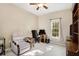 Cozy bedroom with a comfortable chair, desk, and a window letting in natural light at 3302 Dogwood Dr # 328, Atlanta, GA 30354