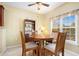 Dining area features a wooden table set, shelving, and large sunny windows at 3302 Dogwood Dr # 328, Atlanta, GA 30354