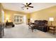 Bright living room featuring a plush leather sofa and ample natural light at 3302 Dogwood Dr # 328, Atlanta, GA 30354