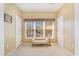 Cozy sitting room with a comfortable bench and natural light, flanked by entry doors at 3302 Dogwood Dr # 328, Atlanta, GA 30354