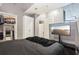 Bedroom featuring an open closet, mounted TV, and gray walls at 361 17Th Nw St # 2315, Atlanta, GA 30363