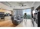 Cozy living room featuring a large window with city views, hardwood floors, and modern furnishings at 361 17Th Nw St # 2315, Atlanta, GA 30363