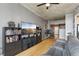 Comfortable living room with hardwood floors, media center, and stylish furnishings with a large window at 361 17Th Nw St # 2315, Atlanta, GA 30363
