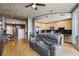 Open-concept living area with hardwood floors, modern furniture, and seamless connection to the kitchen at 361 17Th Nw St # 2315, Atlanta, GA 30363