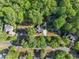Aerial view of a house surrounded by lush greenery in a residential neighborhood at 4680 Brighton Lake Dr, Cumming, GA 30040