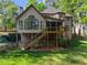 Back of house with a deck overlooking a grassy backyard, great for outdoor living at 4680 Brighton Lake Dr, Cumming, GA 30040