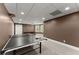 Wide angle view of a finished basement with a ping pong table and carpet flooring at 4680 Brighton Lake Dr, Cumming, GA 30040