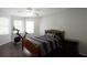 Bedroom featuring hardwood flooring, an exercise bike, and natural light from the windows at 4680 Brighton Lake Dr, Cumming, GA 30040