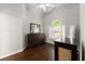 Bedroom with hardwood flooring, neutral paint, arched window and stylish dressers at 4680 Brighton Lake Dr, Cumming, GA 30040