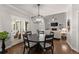 Dining area offering a view into the living room, and access to the outdoors through glass doors at 4680 Brighton Lake Dr, Cumming, GA 30040