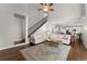 Open floor plan concept with hardwood floors, living room, stairway, and kitchen view at 4680 Brighton Lake Dr, Cumming, GA 30040