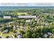 Aerial view of the community including amenities, Bear's Best Atlanta Golf Course, Chattahoochee River and Riverside Elementary School at 5260 Harbury Ln, Suwanee, GA 30024