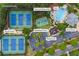 Aerial view of community amenities including a pool, tennis court, basketball court, pool house and playground at 5260 Harbury Ln, Suwanee, GA 30024