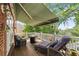Relaxing outdoor deck features comfortable seating, a fire pit, and scenic views at 5260 Harbury Ln, Suwanee, GA 30024