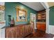 Welcoming entryway featuring hardwood floors, decorative mirror, and custom cabinetry, adding character and style at 5260 Harbury Ln, Suwanee, GA 30024