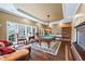 Spacious game room with a pool table, hardwood floors, and ample natural light at 5260 Harbury Ln, Suwanee, GA 30024