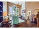 Sunlit living room with fireplace, high ceilings, and large windows offering a view at 5260 Harbury Ln, Suwanee, GA 30024