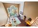 Overhead view of bright living room with soaring windows, fireplace, and comfortable seating at 5260 Harbury Ln, Suwanee, GA 30024