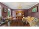 Comfortable living room with hardwood floors, stylish furnishings, and ample natural light, perfect for relaxation at 5260 Harbury Ln, Suwanee, GA 30024