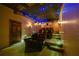 Luxury media room with themed decor, starscape lighting, multi-tiered seating, and sconce lighting at 5260 Harbury Ln, Suwanee, GA 30024