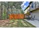Fenced backyard featuring a concrete patio with outdoor seating, ideal for enjoying the natural surroundings at 5870 Shiloh Woods Dr, Cumming, GA 30040