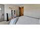 This bedroom features neutral walls and trim and a doorway to another room, promoting flow at 5870 Shiloh Woods Dr, Cumming, GA 30040