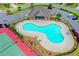 Aerial view of a uniquely shaped community pool, offering residents a refreshing and fun amenity at 5870 Shiloh Woods Dr, Cumming, GA 30040