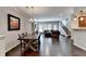 Open-concept living area with hardwood floors and a view into the dining room at 5870 Shiloh Woods Dr, Cumming, GA 30040