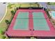 Aerial view of well-maintained tennis courts, a great amenity for active residents at 5870 Shiloh Woods Dr, Cumming, GA 30040