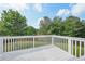 Enjoy the outdoors on this well-maintained deck overlooking the grassy backyard and mature trees at 7169 Sweet Gum Ct, Lithonia, GA 30058