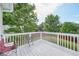 Outdoor living is easy on this elevated deck with white railings, perfect for relaxing in the backyard at 7169 Sweet Gum Ct, Lithonia, GA 30058